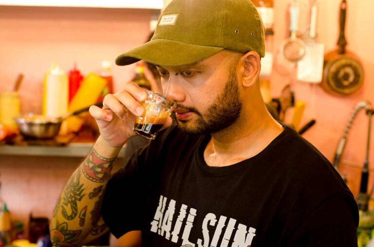 Jisnu Barista Ubud smelling a cup of espresso. Photo: pourmorecoffee.com